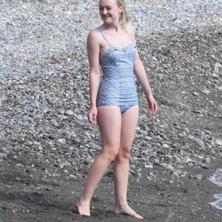 Dakota Fanning in Vintage Blue Swimsuit on the Set of “Ripley” in Italy