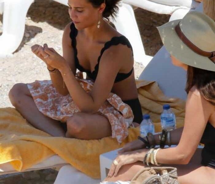 Alicia Vikander in a Chic Black Bikini at the Beach in Ibiza