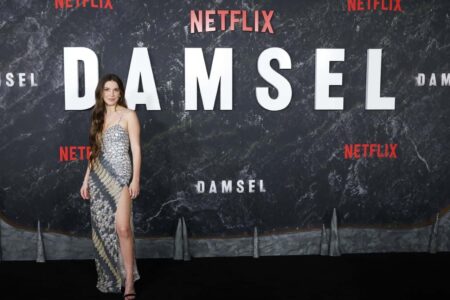 Millie Bobby Brown Radiates in Silver Gown at “Damsel” Premiere