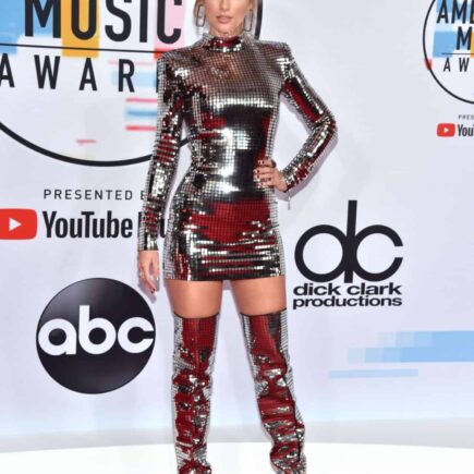 Taylor Swift Shines in Silver Mini Dress and Thigh-High Boots at AMAs