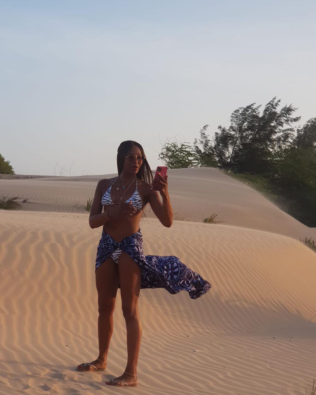 During her trip to Africa, the supermodel posed in the desert sand, dressed in Melissa Odabash's 