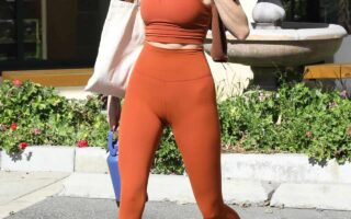 Kendall Jenner Flashes her Taut Midriff in Orange Athletic Wear in WeHo