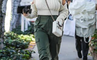 Chrissy Teigen Looks Fantastic in a White Knitted Sweater and Cargo Pants