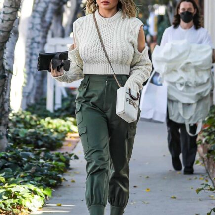 Chrissy Teigen Looks Fantastic in a White Knitted Sweater and Cargo Pants