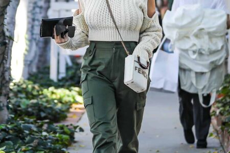 Chrissy Teigen Looks Fantastic in a White Knitted Sweater and Cargo Pants
