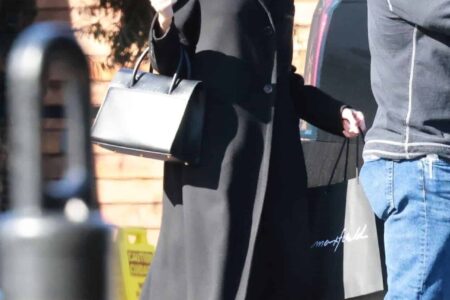 Angelina Jolie Looks Stunning in Black while Shopping on Christmas Eve