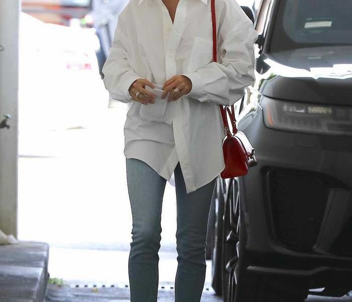 Hailey Rhode Bieber in Balenciaga White Shirt & Khaite Kyle Blue Jeans Visiting a Skincare Clinic