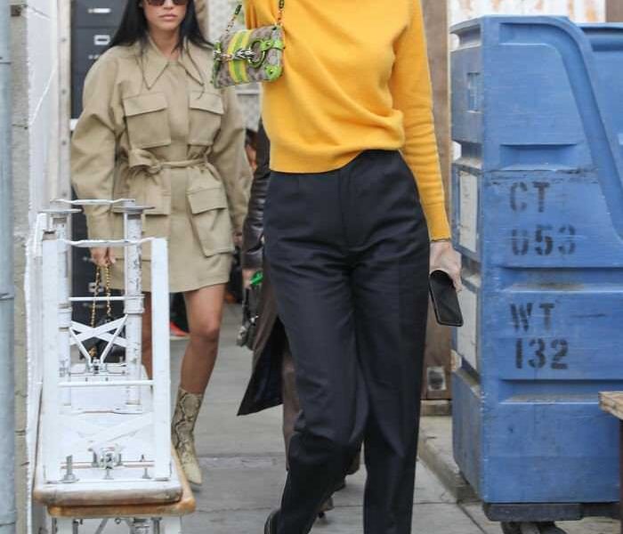 Kendall Jenner in a Black Pants & Yellow Sweater Out in Venice