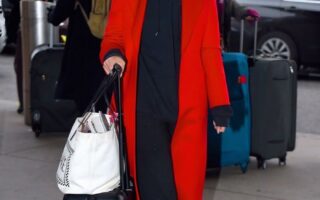 Emily Ratajkowski in Red Overcoat with Casual Sweats at JFK Airport