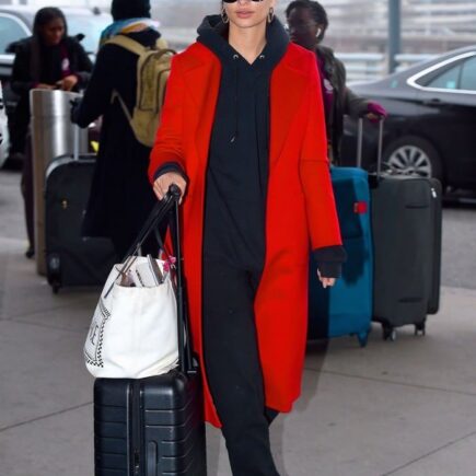 Emily Ratajkowski in Red Overcoat with Casual Sweats at JFK Airport