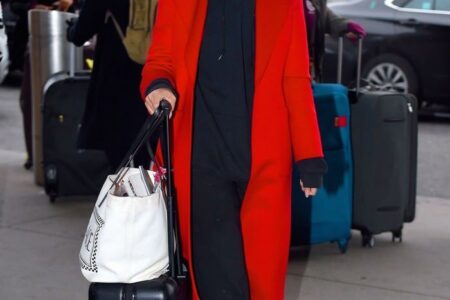 Emily Ratajkowski in Red Overcoat with Casual Sweats at JFK Airport