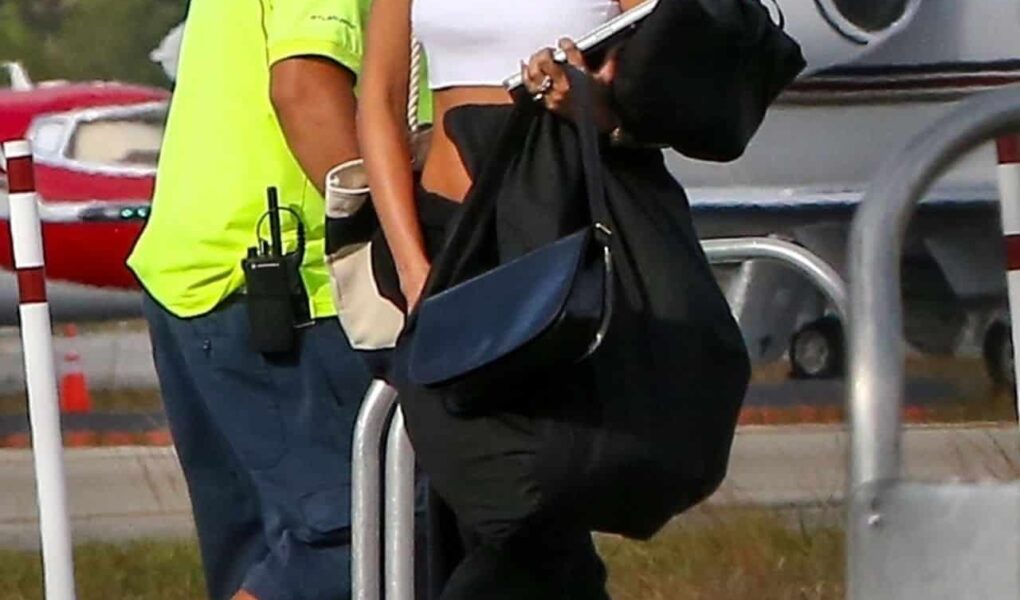 Hailey Bieber in a Crop Top and Sweats Steps Off a Private Plane in Miami