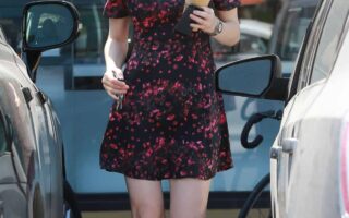 Alexandra Daddario Wore a Black Floral Dress while Leaving Earth Bar in LA