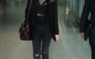 Emma Watson Looks Chic in an All-Black Outfit at Heathrow Airport in London