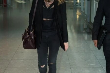 Emma Watson Looks Chic in an All-Black Outfit at Heathrow Airport in London