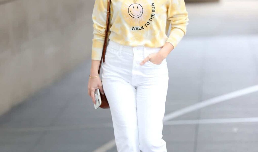 Mollie King Wears Yellow Sweater and White Jeans on her Way to BBC Radio 1