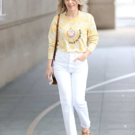 Mollie King Wears Yellow Sweater and White Jeans on her Way to BBC Radio 1