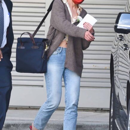 Katie Holmes Unrecognizable at JFK Airport in New York