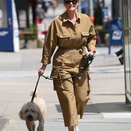 Georgina Burke Takes her Dog Out for a Morning Stroll in NY