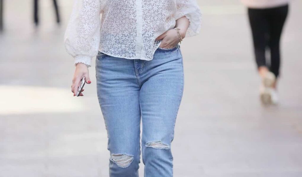 Kelly Brook in a Semi-sheer Floral Blouse and Denim