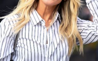 Ashley Roberts is Chic in a Striped Blouse and Black Pants