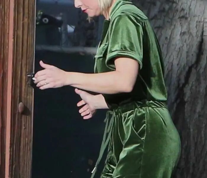 Kristen Bell Dressed for the Holidays in Green Overalls and a Santa Hat in LA