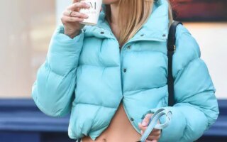 Kimberley Garner Flashes Her Abs and a Black Sports Bra while Walking Her Dog