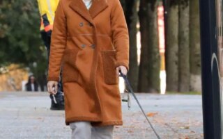 Lili Reinhart in the Brown Fleece-lined Coat Takes her Dog for a Walk in Vancouver