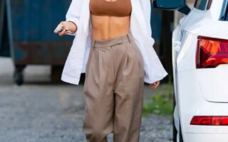 Emily Ratajkowski Reveals Her Toned Abs in a White Shirt and Bra Top