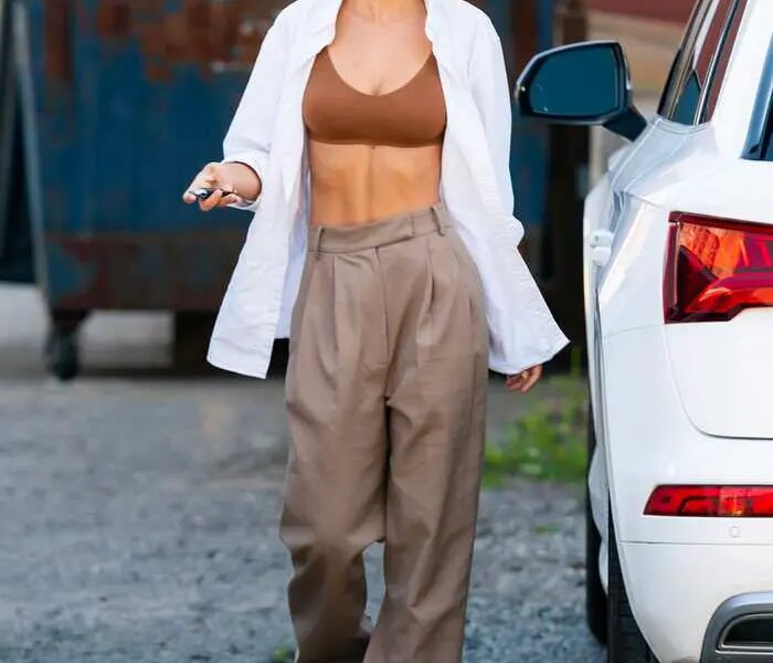 Emily Ratajkowski Reveals Her Toned Abs in a White Shirt and Bra Top