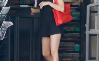 Emma Roberts in a Chic Black Dress During Coffee Run