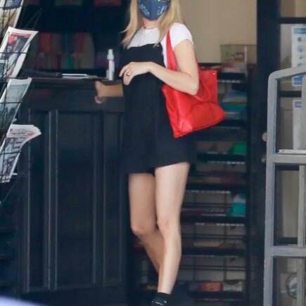 Emma Roberts in a Chic Black Dress During Coffee Run