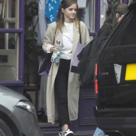 Emma Watson Fashions a Stylish Figure in a Stone Trench Coat