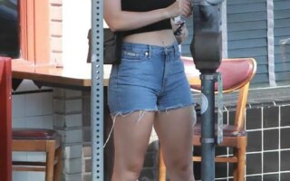 Charli XCX Showcases Her Toned Abs and Legs in Denim Shorts
