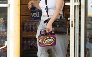 Ariel Winter in a Rolling Stones T-shirt Stocks Up Alcohol