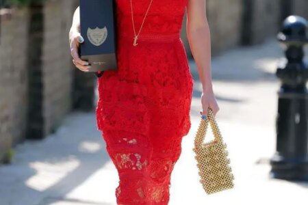 Caprice Bourret in Red Dress Carrying a Bottle of Dom Pérignon