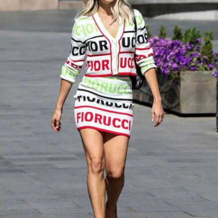 Ashley Roberts Exposing her Legs in a Striking Logo-print Mini-skirt