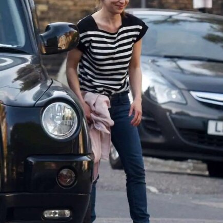 Emilia Clarke Cuts a Casual Figure in Black and White Striped T-Shirt