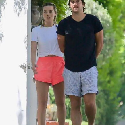 Margot Robbie in Pink Running Shorts Steps Out With Her Husband