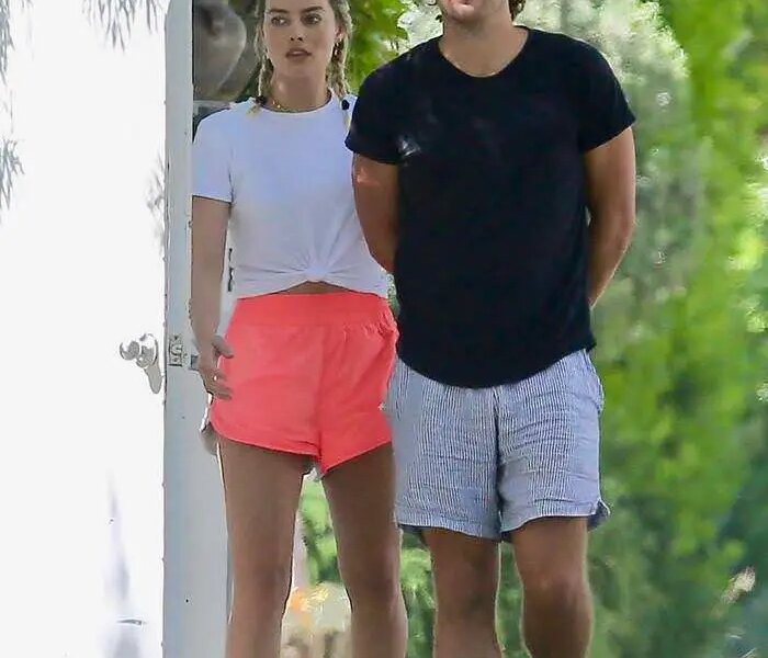 Margot Robbie in Pink Running Shorts Steps Out With Her Husband