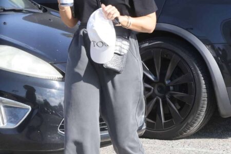 Jessica Alba Sports Trendy White Sneakers with Dark-Colored Clothing