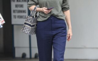 Alexandra Daddario Exudes Casual Chic in Olive Sweater and Navy Pants