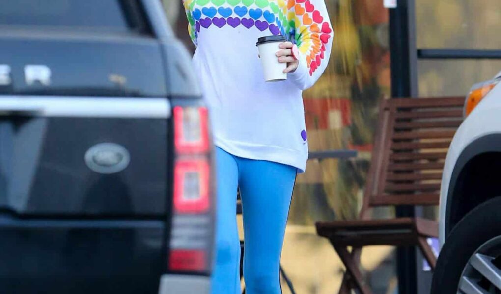 Miley Cyrus Embraces Casual Chic in Rainbow Heart Sweater and Blue Leggings