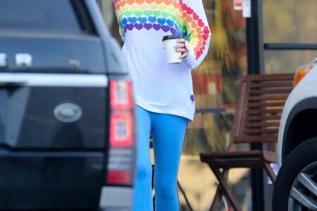 Miley Cyrus Embraces Casual Chic in Rainbow Heart Sweater and Blue Leggings