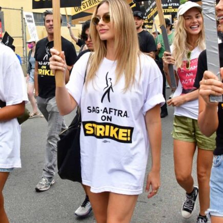 Margot Robbie Shows Solidarity with Writers Guild in “Double Strike”