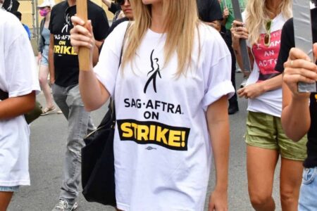 Margot Robbie Shows Solidarity with Writers Guild in “Double Strike”