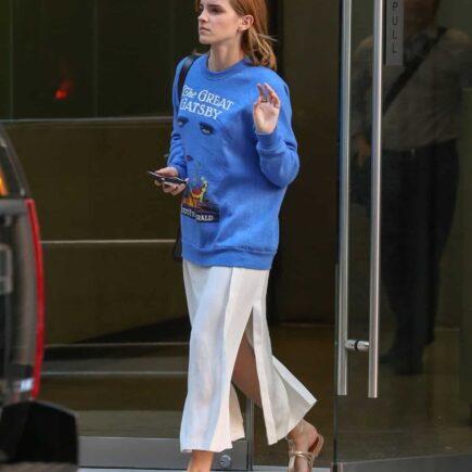 Emma Watson Stuns in Cream Dress and Vibrant Blue Sweater in New York City