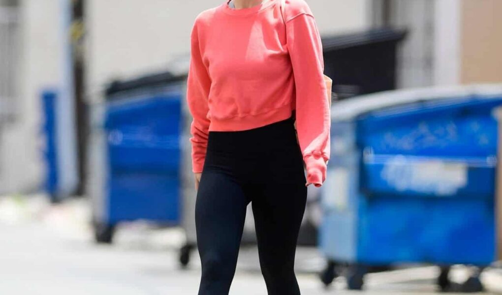 Olivia Wilde Leaves the Gym in Hot Pink Crew-Neck Sweater and Black Leggins