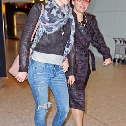 Emma Watson Nails the Chic Travel Look in a Black Sweater and Skinny Jeans