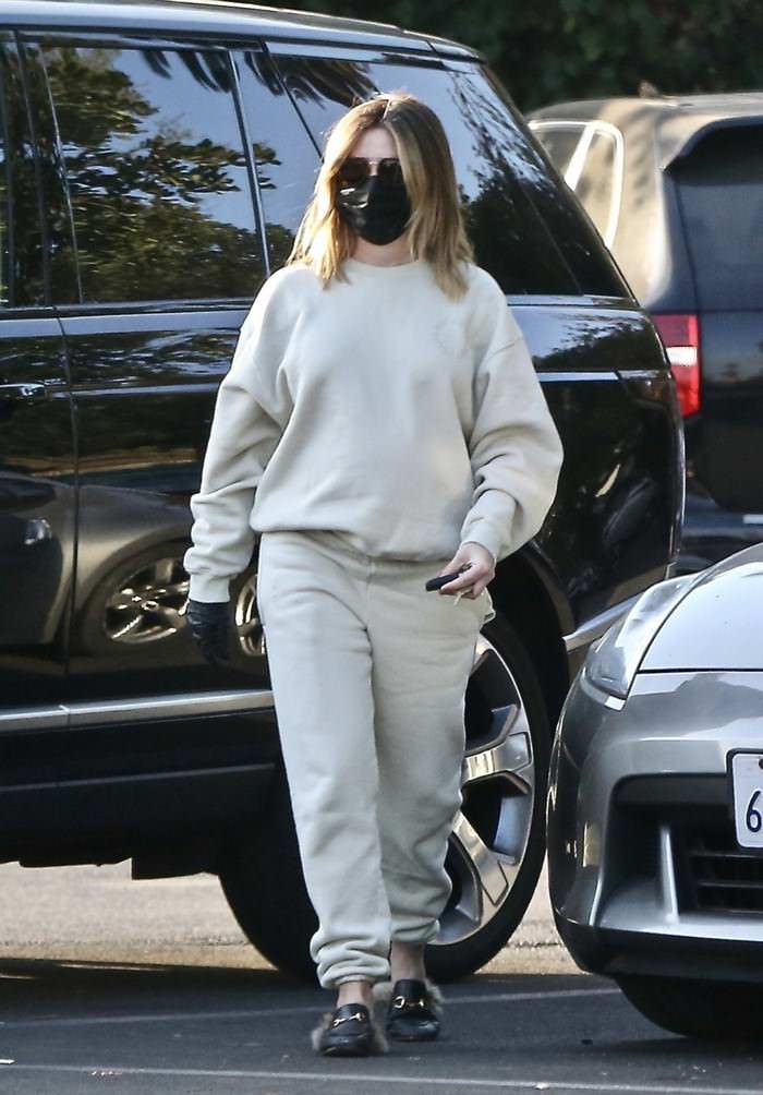 ashley tisdale opts for beige sweatsuit and black face mask on a coffee run in la 1